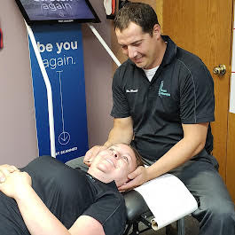 Chiropractic adjustment to reduce migraine pain and improve posture in Eagan